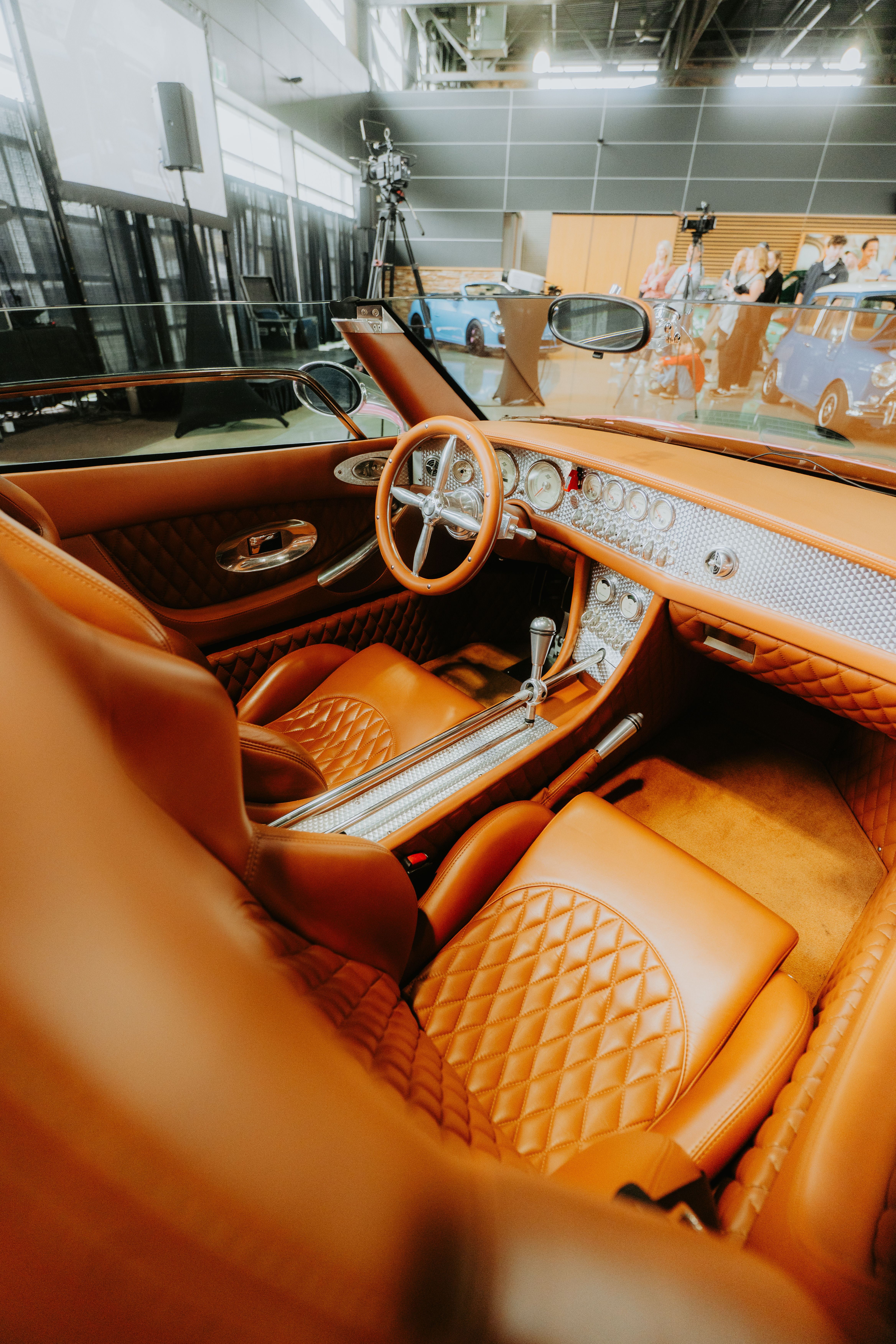 Finished bespoke leather cabin showing upholstery and instrument detailing